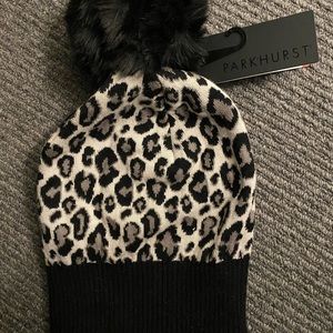 Leopard toque with pom. Brand new never worn. Still has tag.